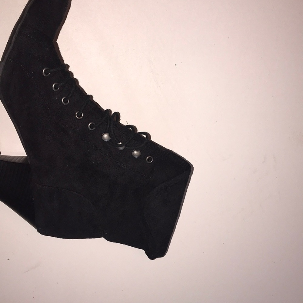 Laced up high heel boots